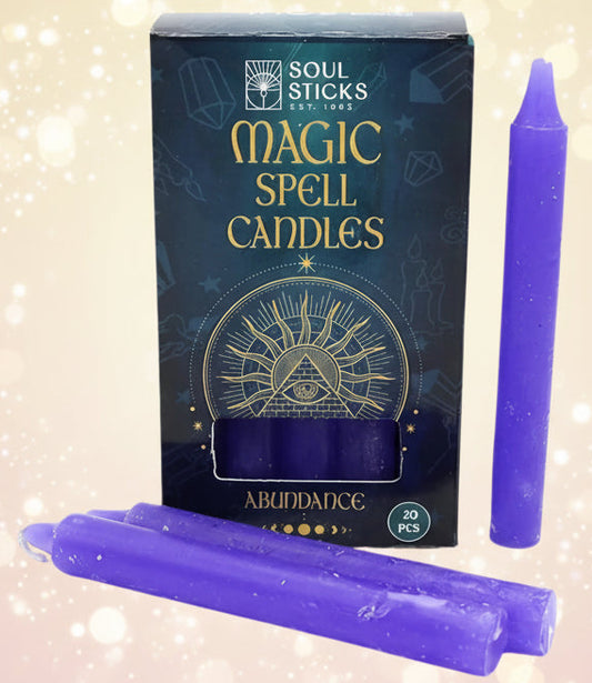 Purple spell candles with packaging labeled 'Magic Spell Candles' by Soul Sticks on a white background.