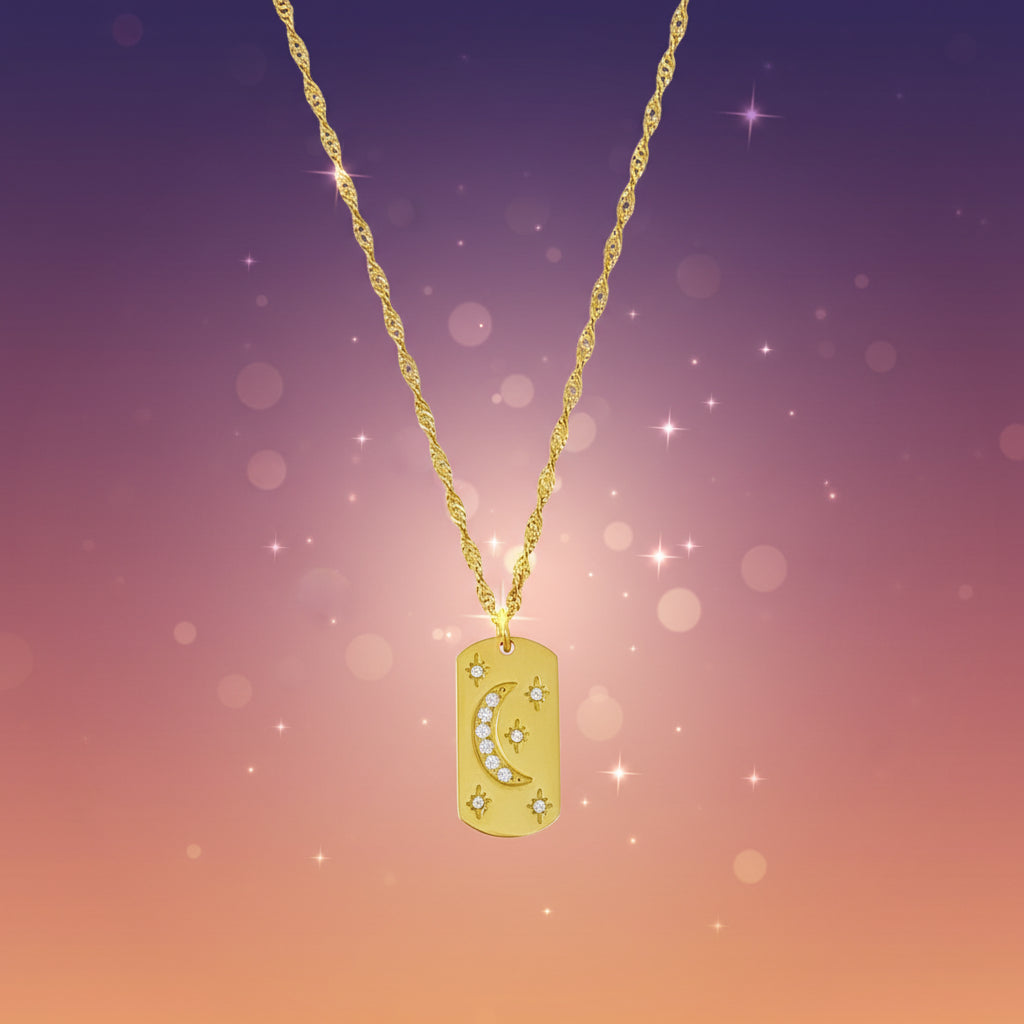 Gold necklace with a pendant on a marble background
