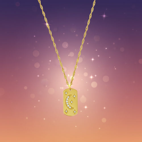Gold necklace with a pendant on a marble background