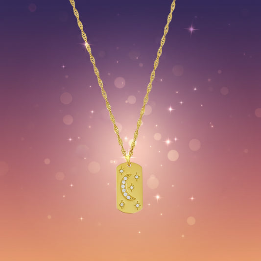 Gold necklace with a pendant on a marble background