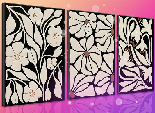 Set of three floral wall art panels with white flowers on a black background
