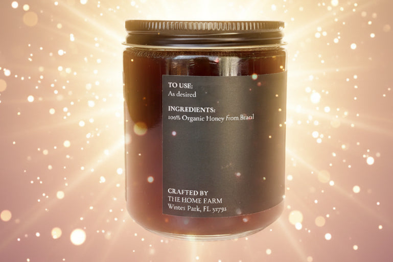 Jar of honey with a label on a white background