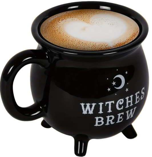 Black 'Witches Brew' mug with a hot beverage on an orange background