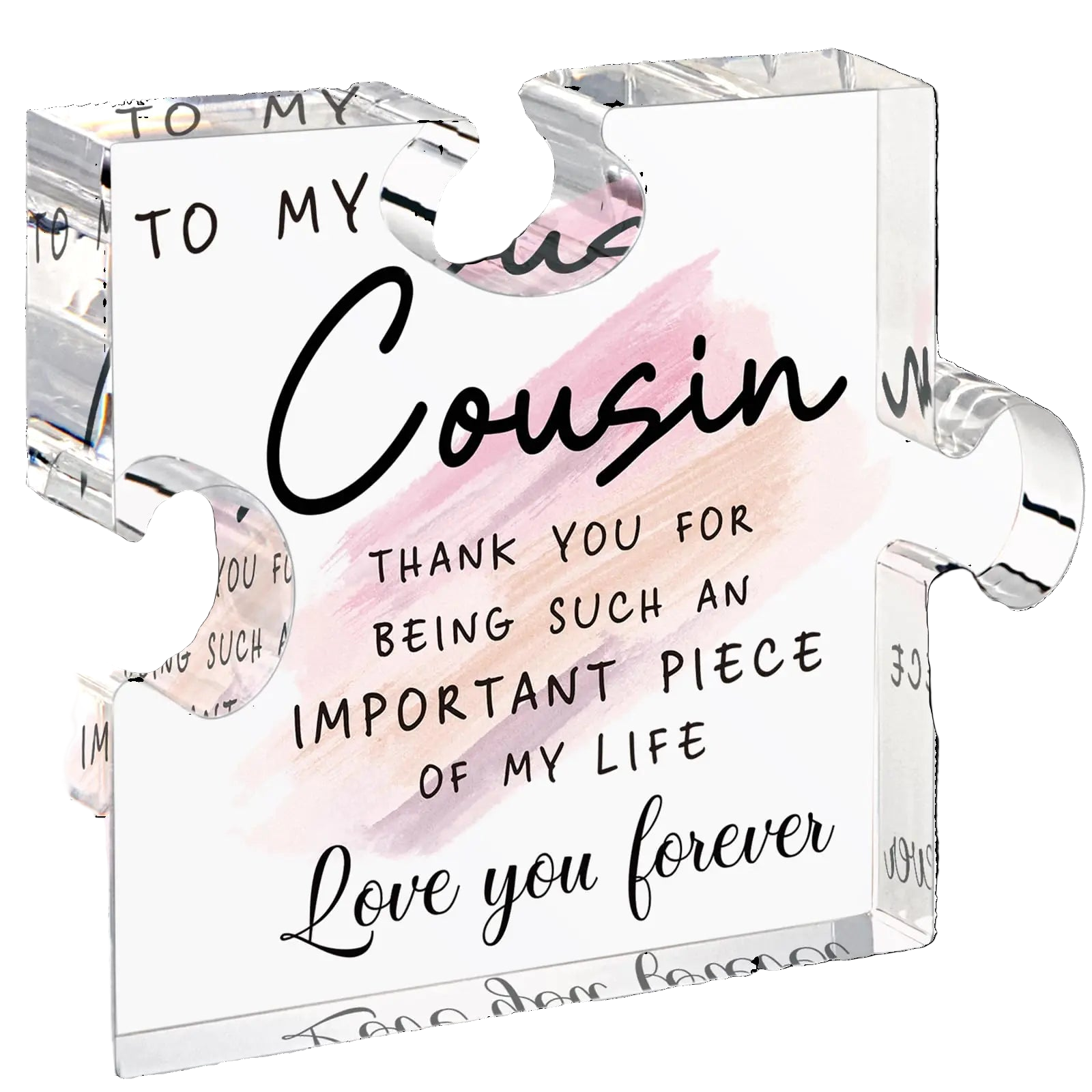 Clear glass block with engraved message to a cousin on a white background