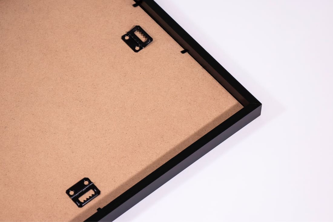 Wooden picture frame corner with a white background