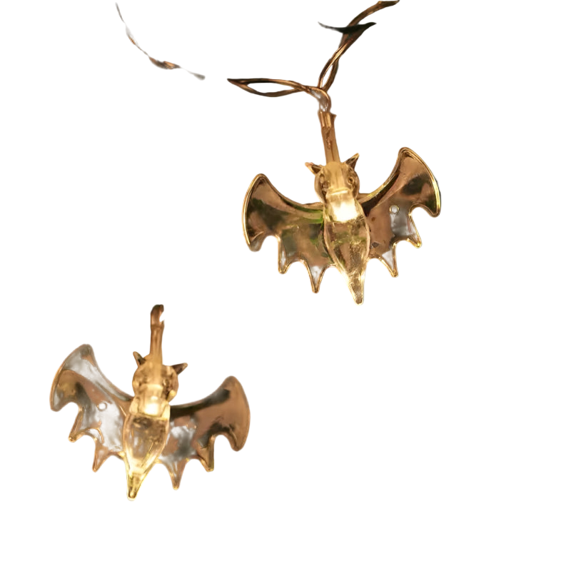 Bat-shaped string lights on a Christmas tree