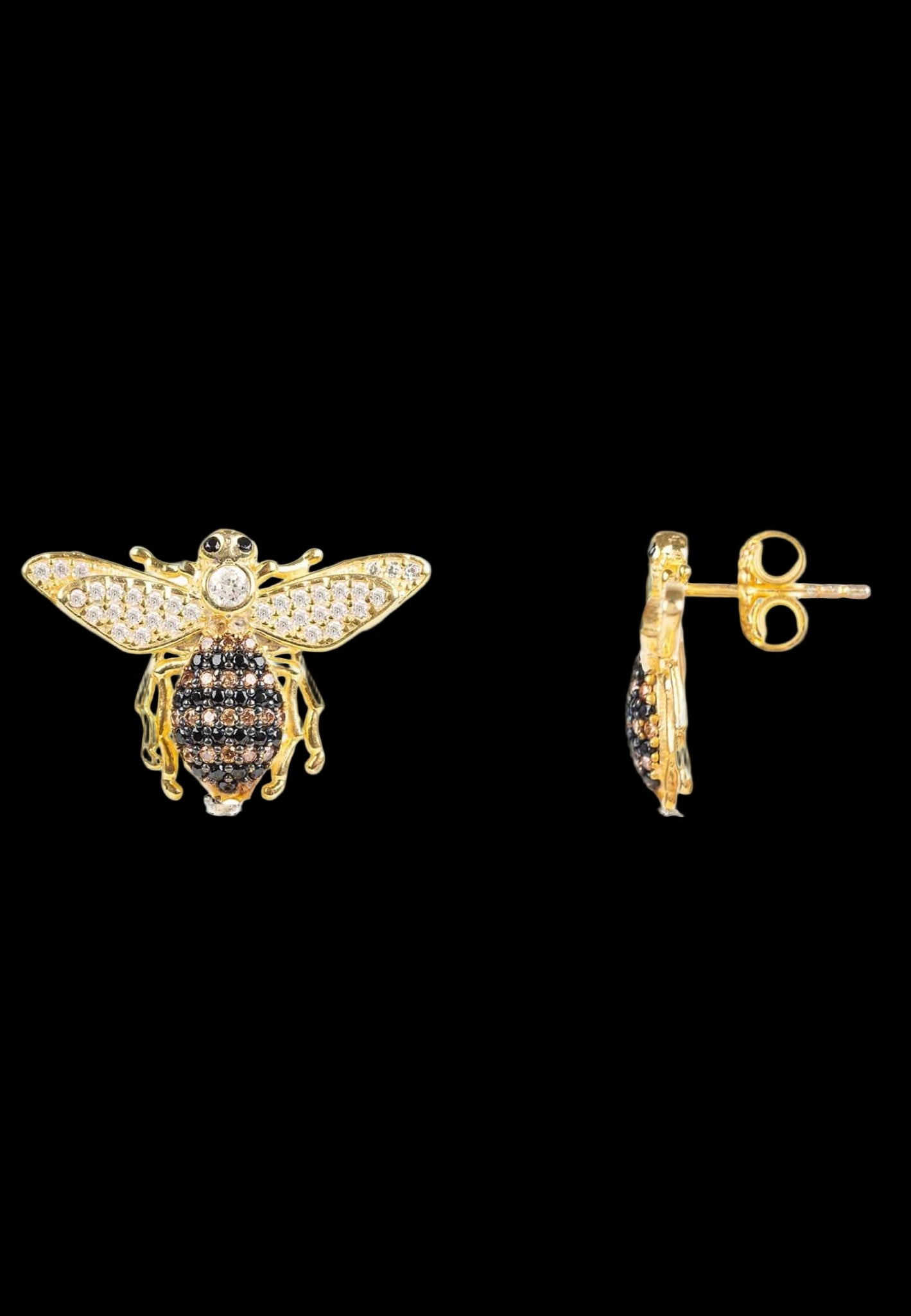 Gold bee-shaped earrings with black and clear gemstones on a white background