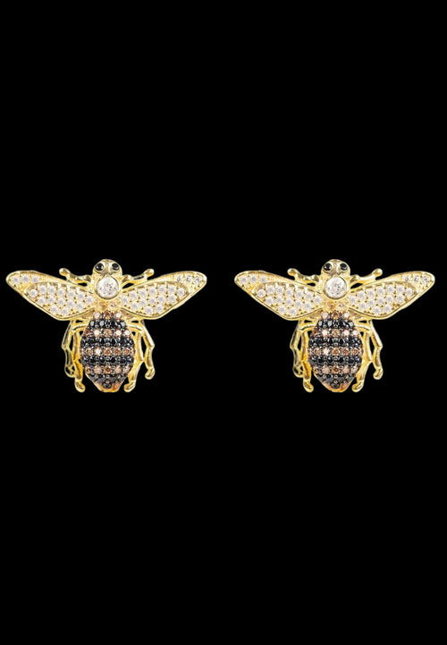 Gold bee-shaped earrings with black gemstones on a white background