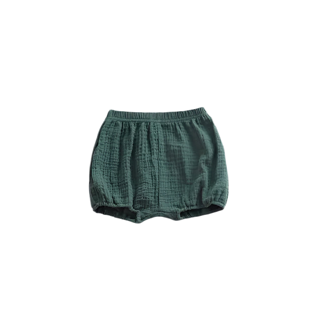 Green baby bloomers on a white background