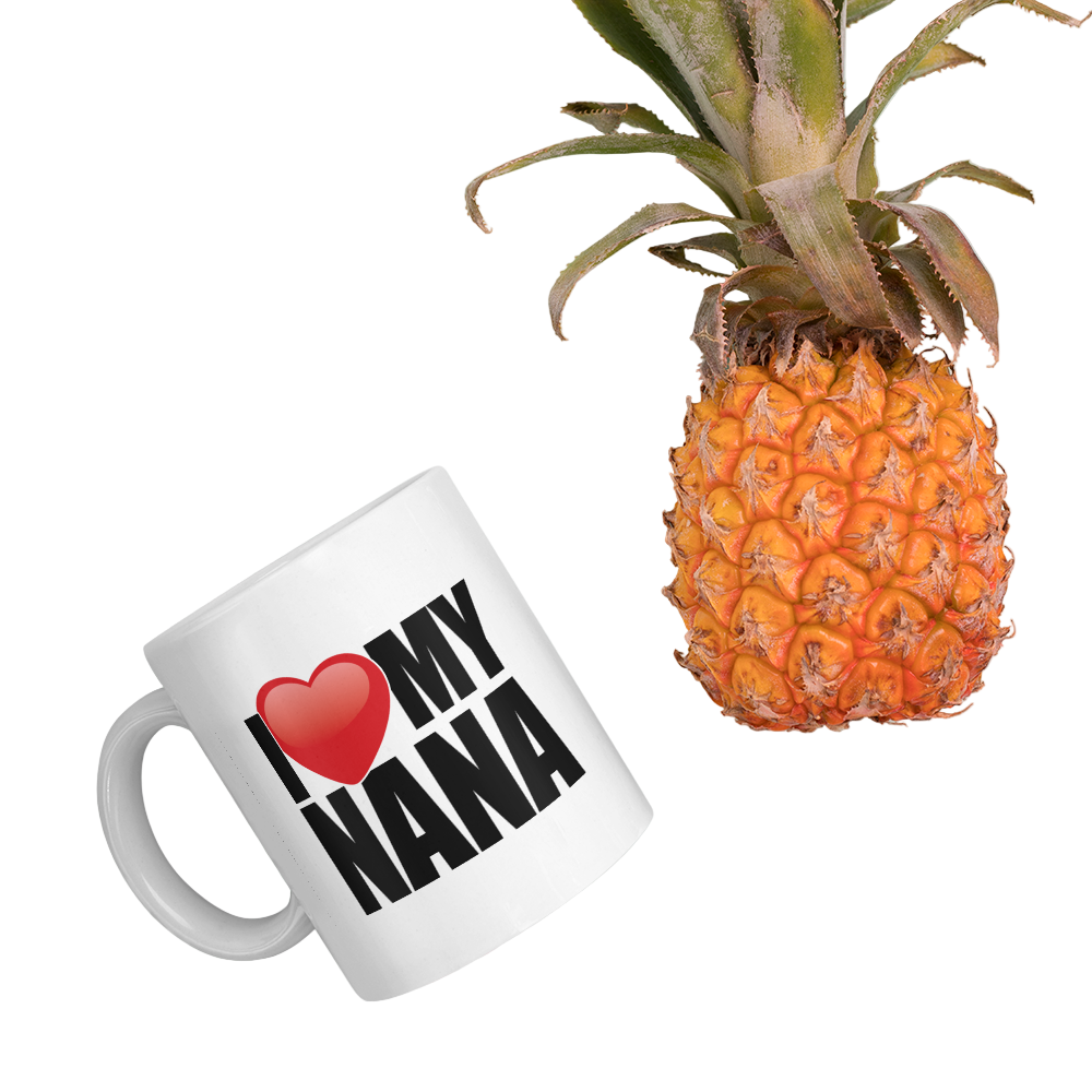 White mug with 'I ❤️ MY NANA' text next to a pineapple on a light green background