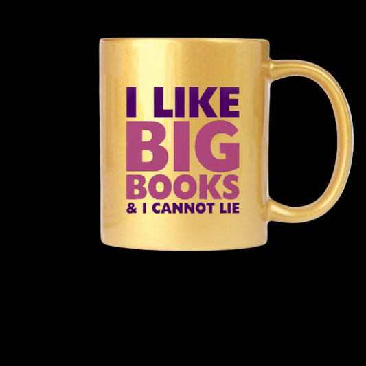 Gold mug with purple text 'I LIKE BIG BOOKS & I CANNOT LIE' on a white surface with a plant and keyboard in the background.