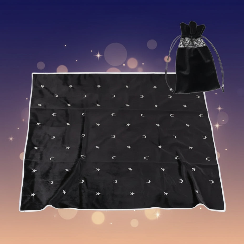 Black satin sheet with celestial pattern and black drawstring bag on a white background