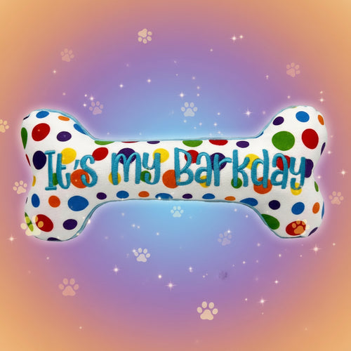 Polka dot bone-shaped toy with 'It's my barkday' text on a white background