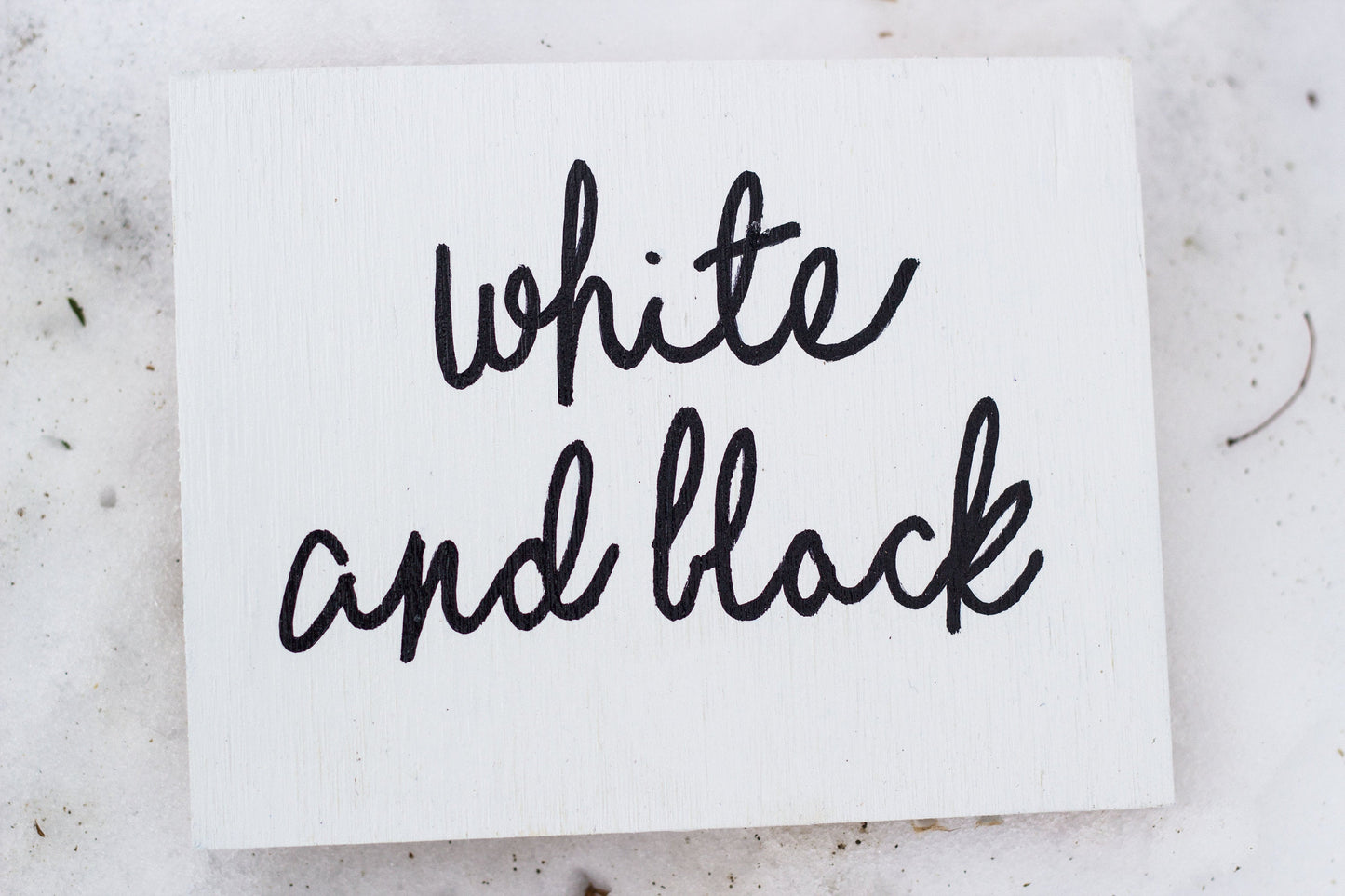 White card with 'white and black' text on a light gray background