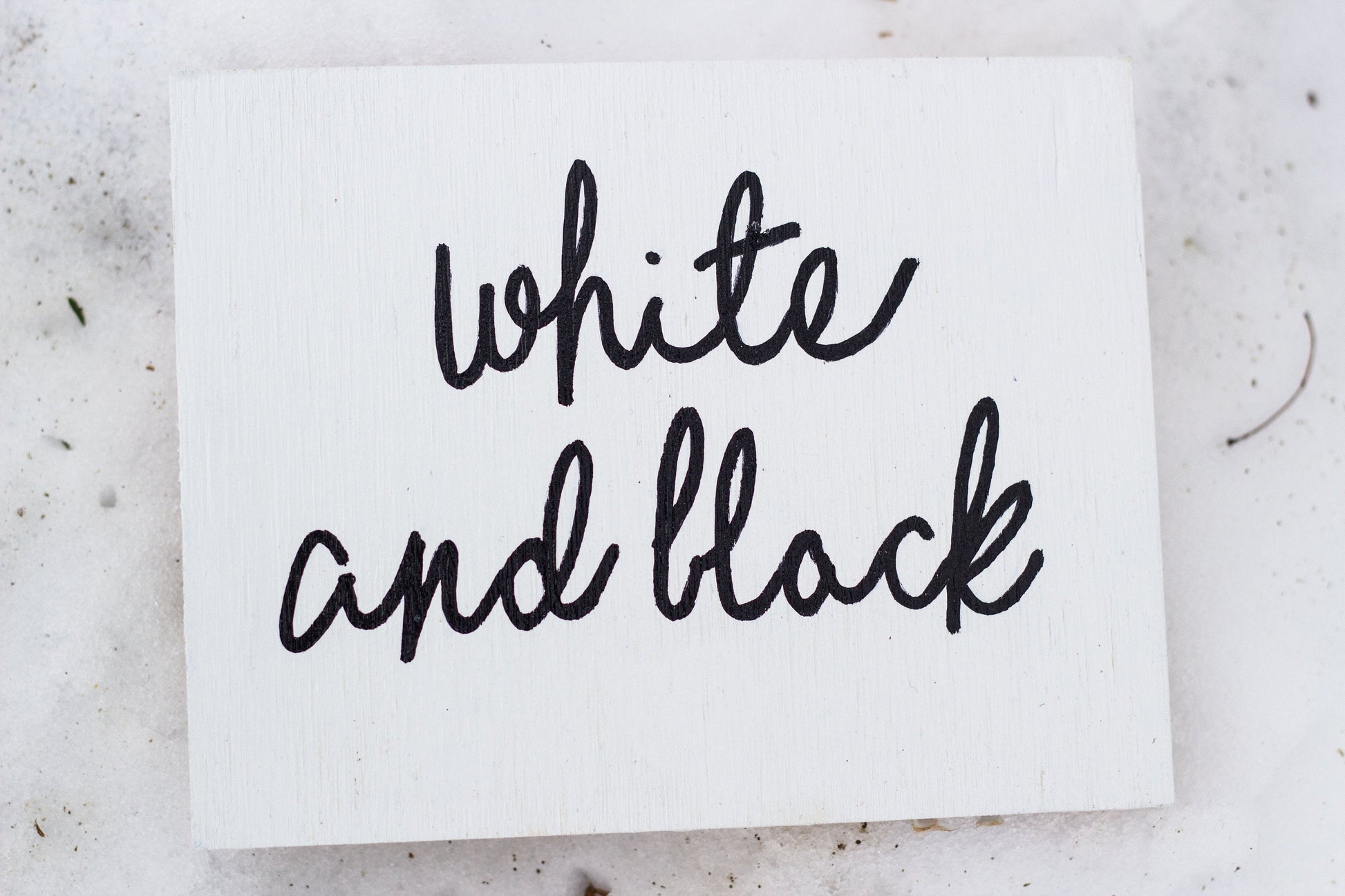 White card with 'white and black' text on a light gray background