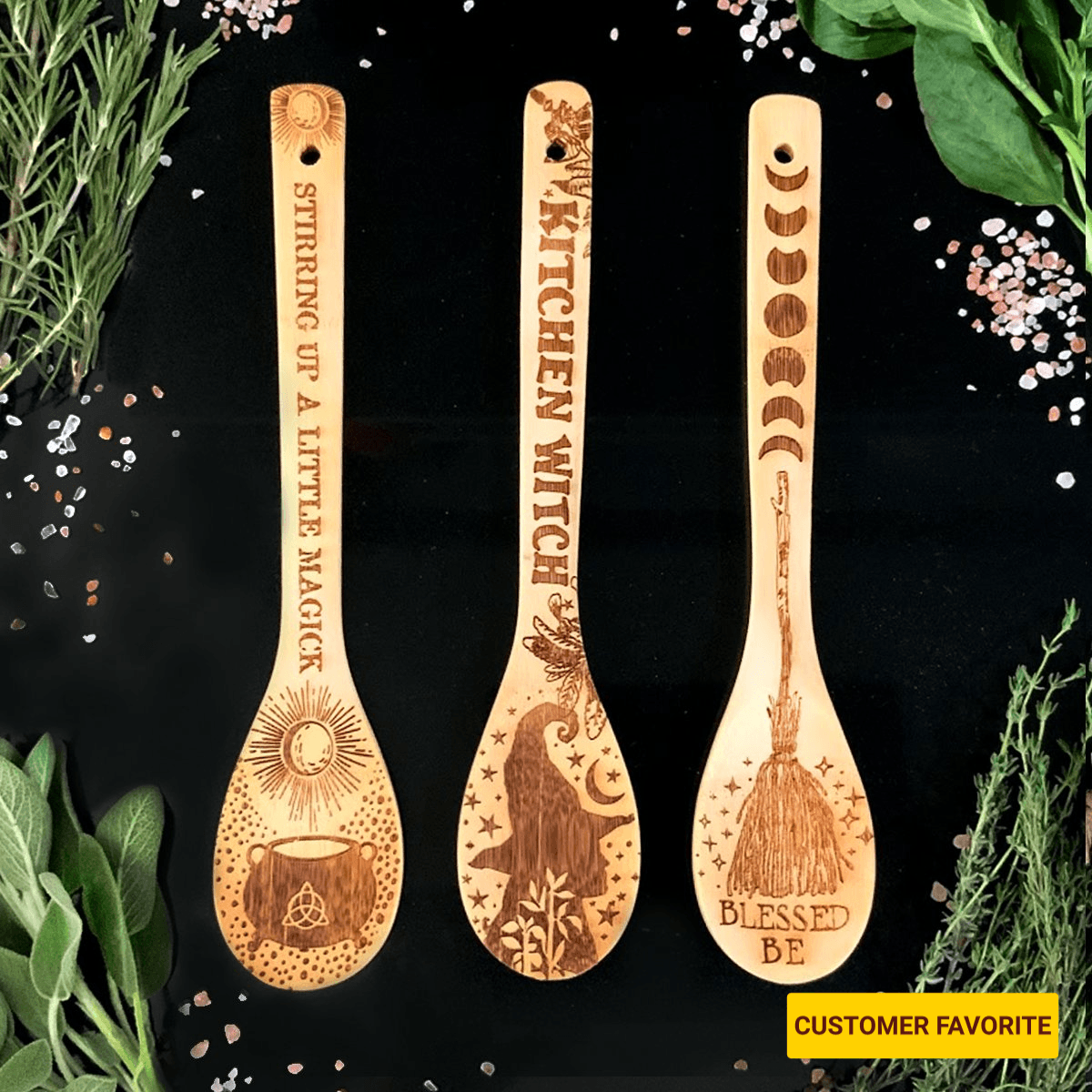 Three wooden spoons with engraved designs and text on a black background with herbs.
