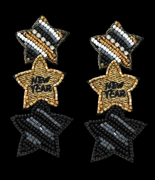 Star-shaped earrings with black, gold, and white beads on a white background