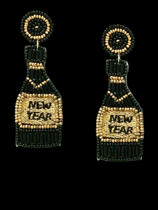 Beaded earrings with 'New Year' text next to a quarter for scale on a white background