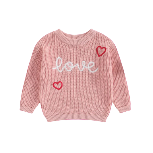 Pink sweater with 'love' and heart designs on a white background