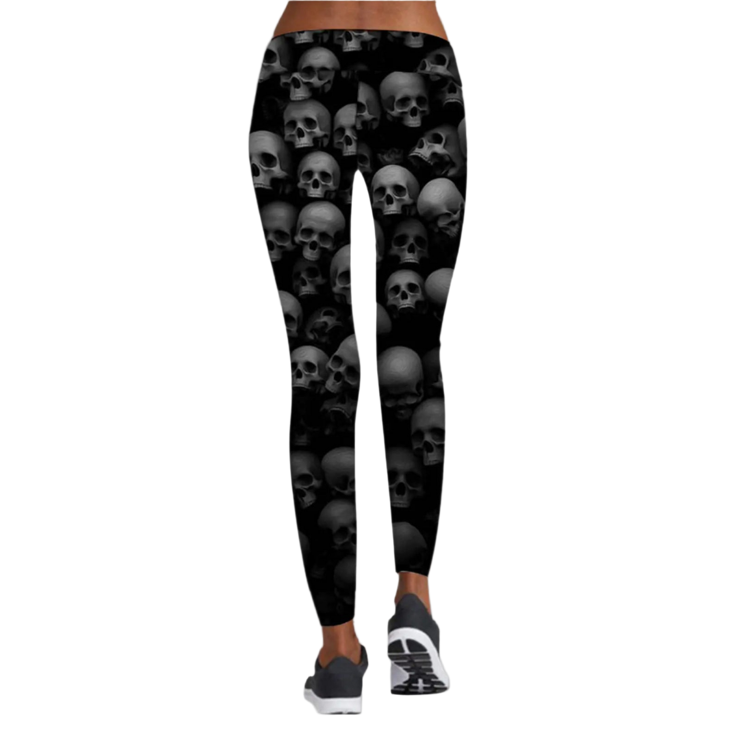 Black leggings with skull pattern worn by a person on a white background