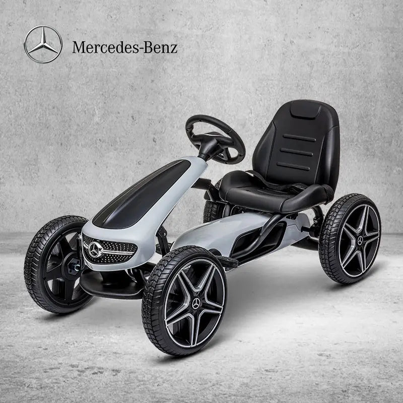 Mercedes-Benz pedal car on a gray background