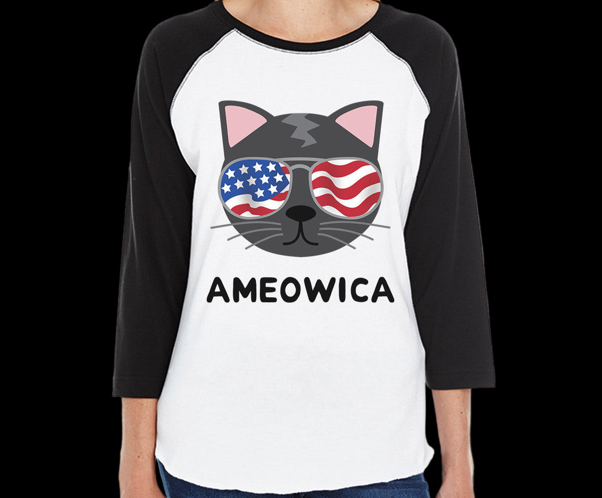 Person wearing a black and white baseball shirt with a cat design and 'AMEOWICA' text.