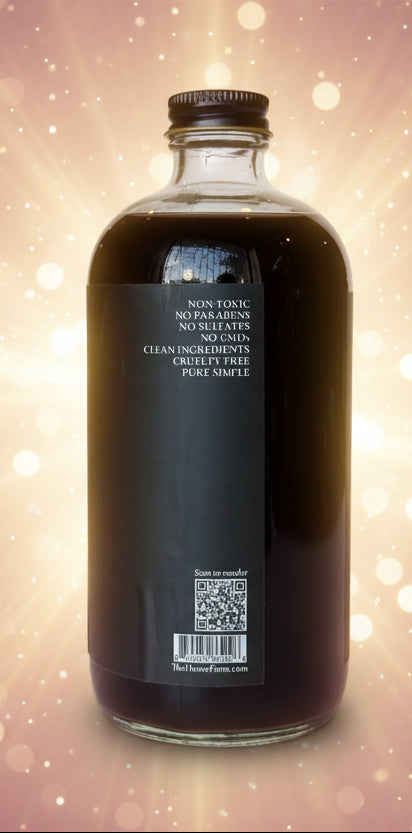 Clear glass bottle with black cap on a light gray background