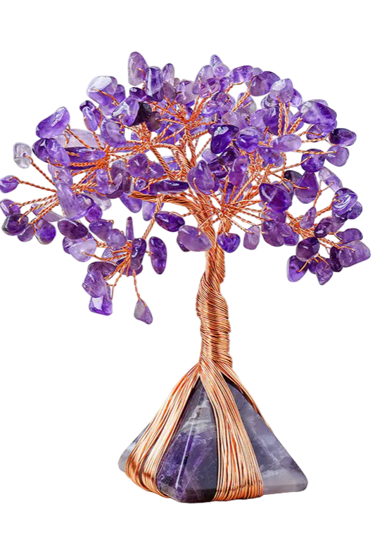 Purple crystal tree on a wooden surface with a white background