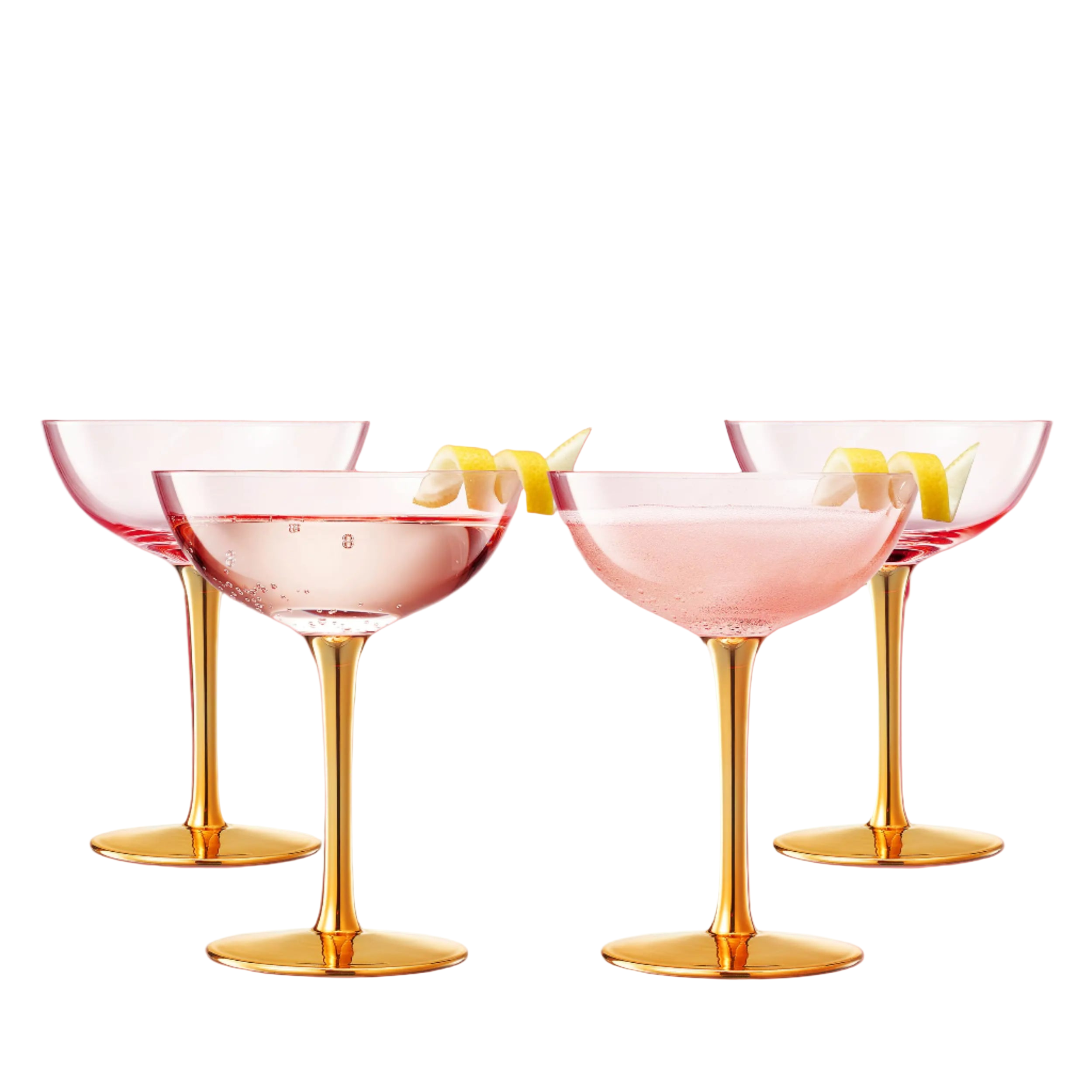 Set of four cocktail glasses with gold stems and pink interiors, accompanied by a decorative box.