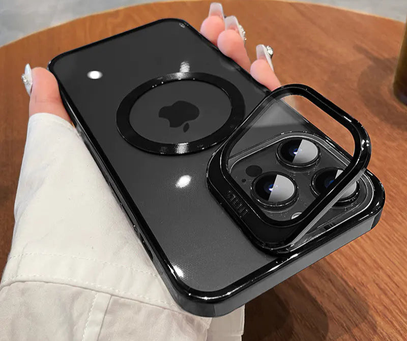 Black phone case with Apple logo held by a person on a wooden surface
