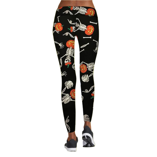 Black leggings with Halloween-themed design featuring skeletons and pumpkins on a white background.