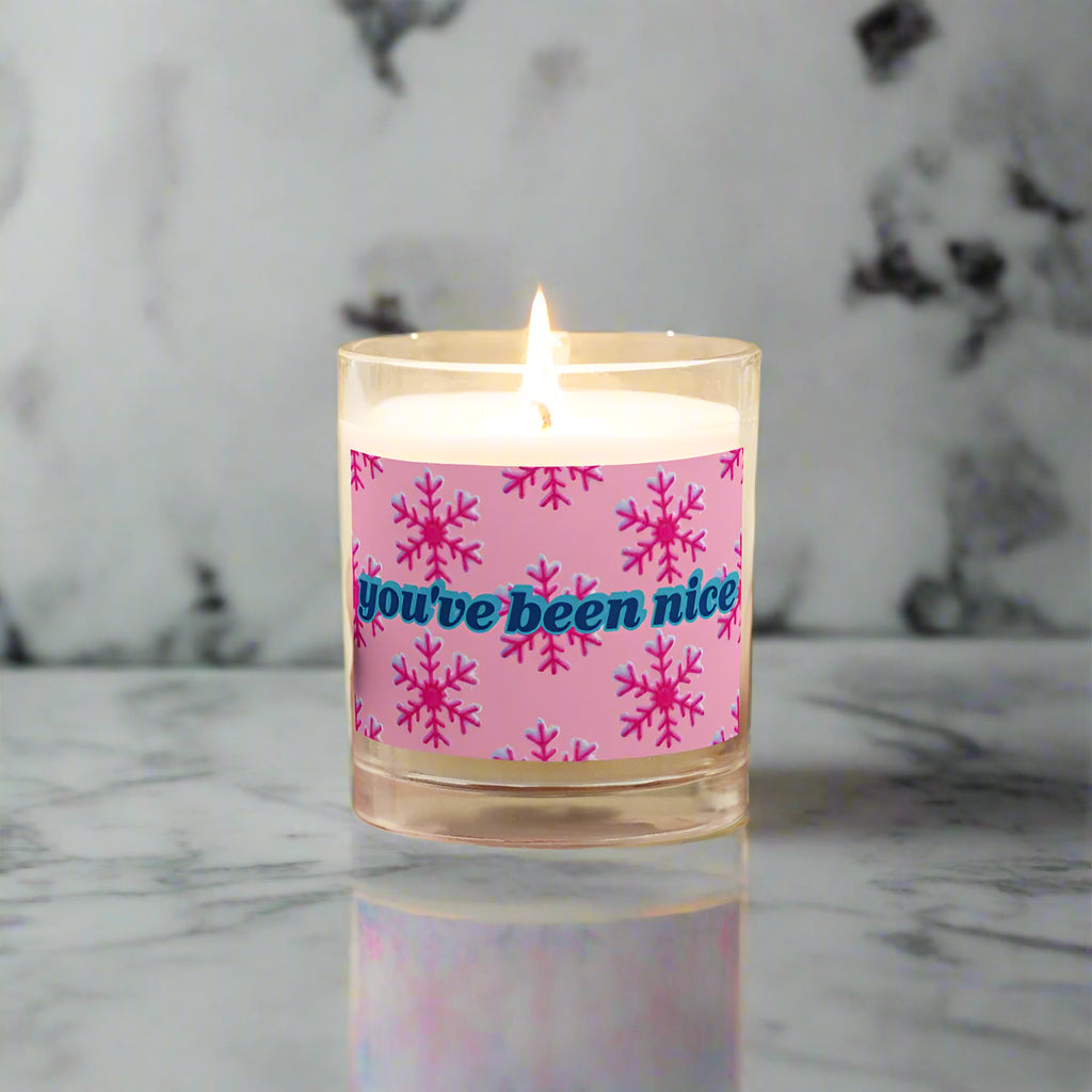 white candle with pink label and pink snowflakes