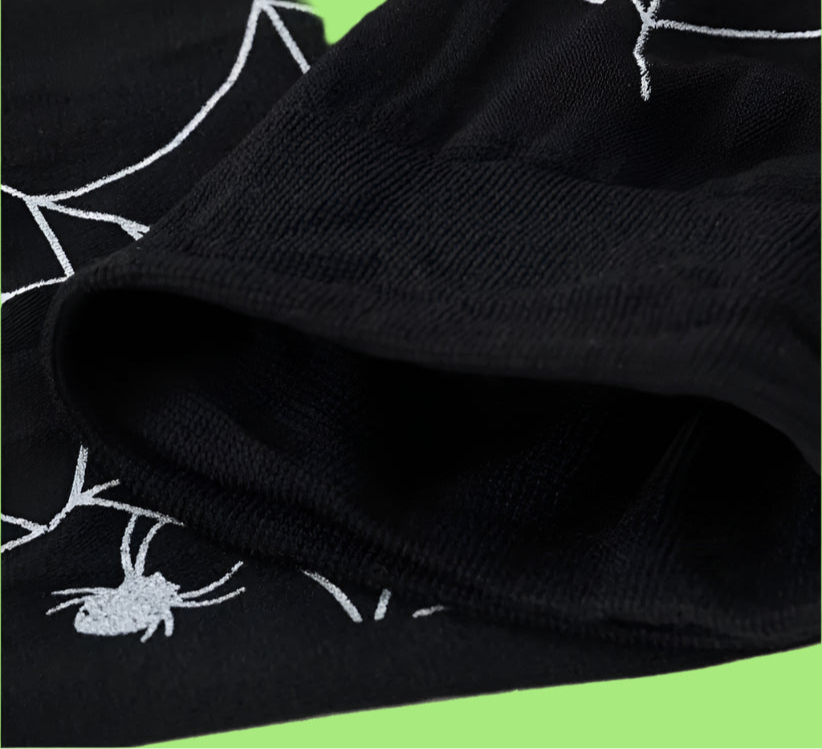Black fabric with white spider web pattern