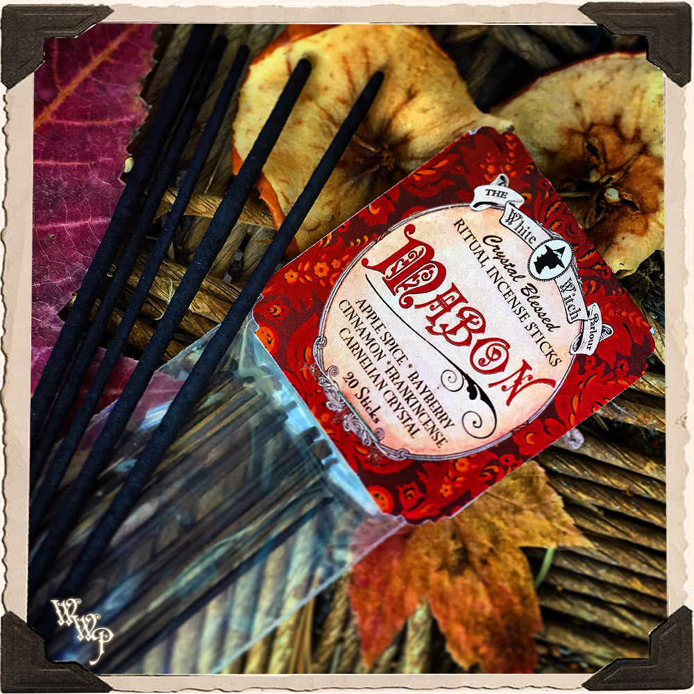 Incense sticks with a red label on a decorative background