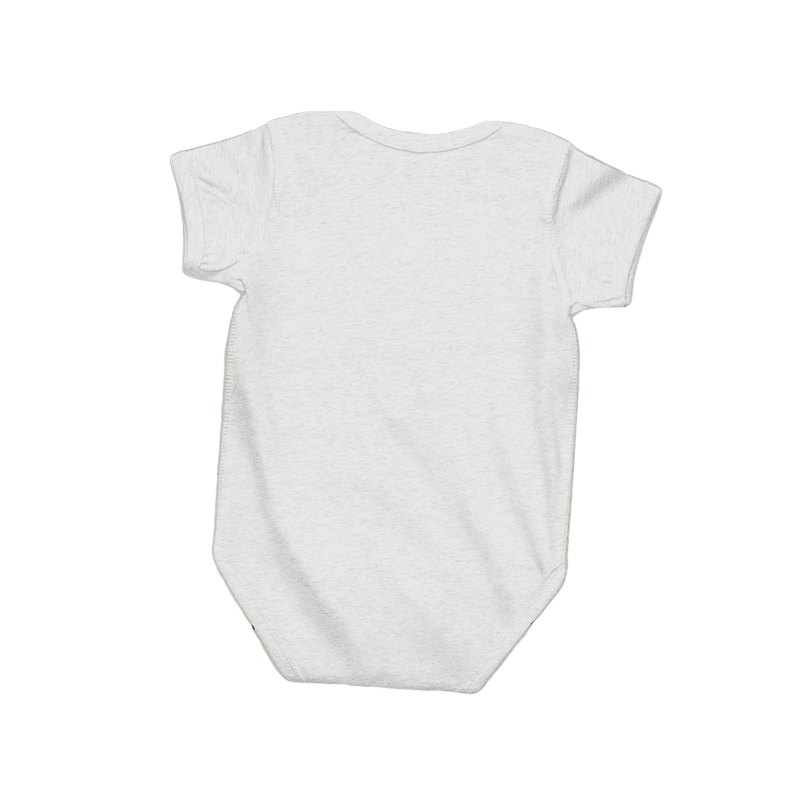 White baby onesie on a light wooden surface