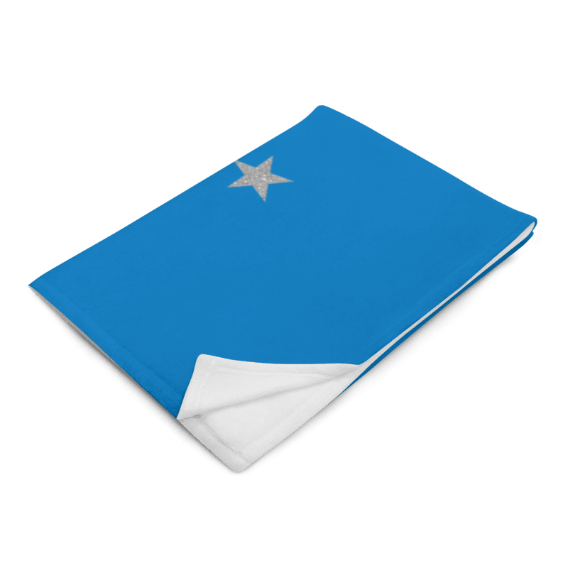 Blue blanket with a silver star on a white background