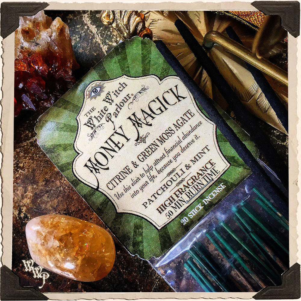 Incense package labeled 'Honey Magick' with crystals and herbs on a textured background