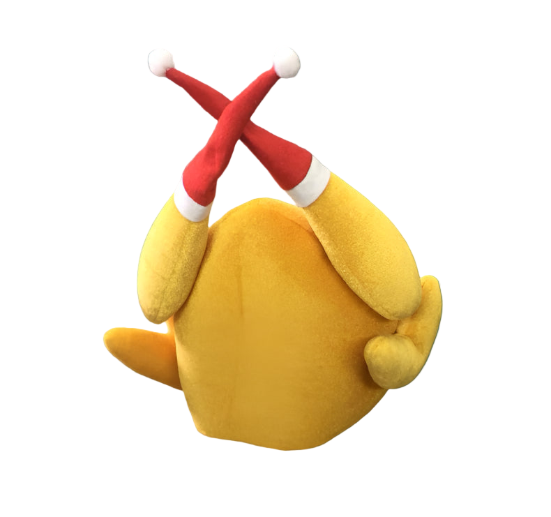 Yellow plush toy with red antlers on a textured gray surface