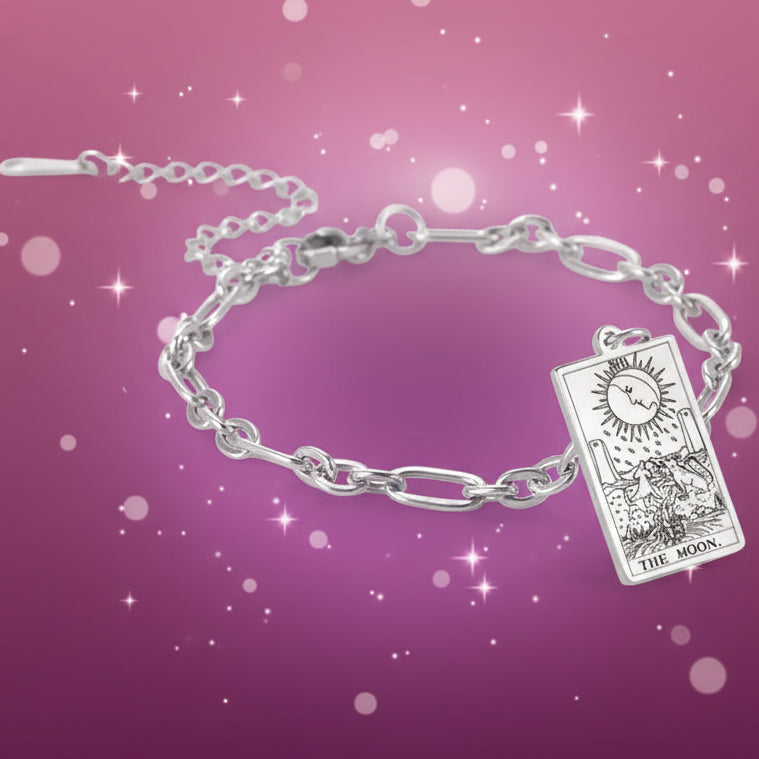 Silver bracelet with a tarot card charm on a white background