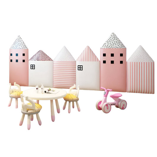 Children's play area with toy table, chairs, and tricycle in front of patterned wall panels.