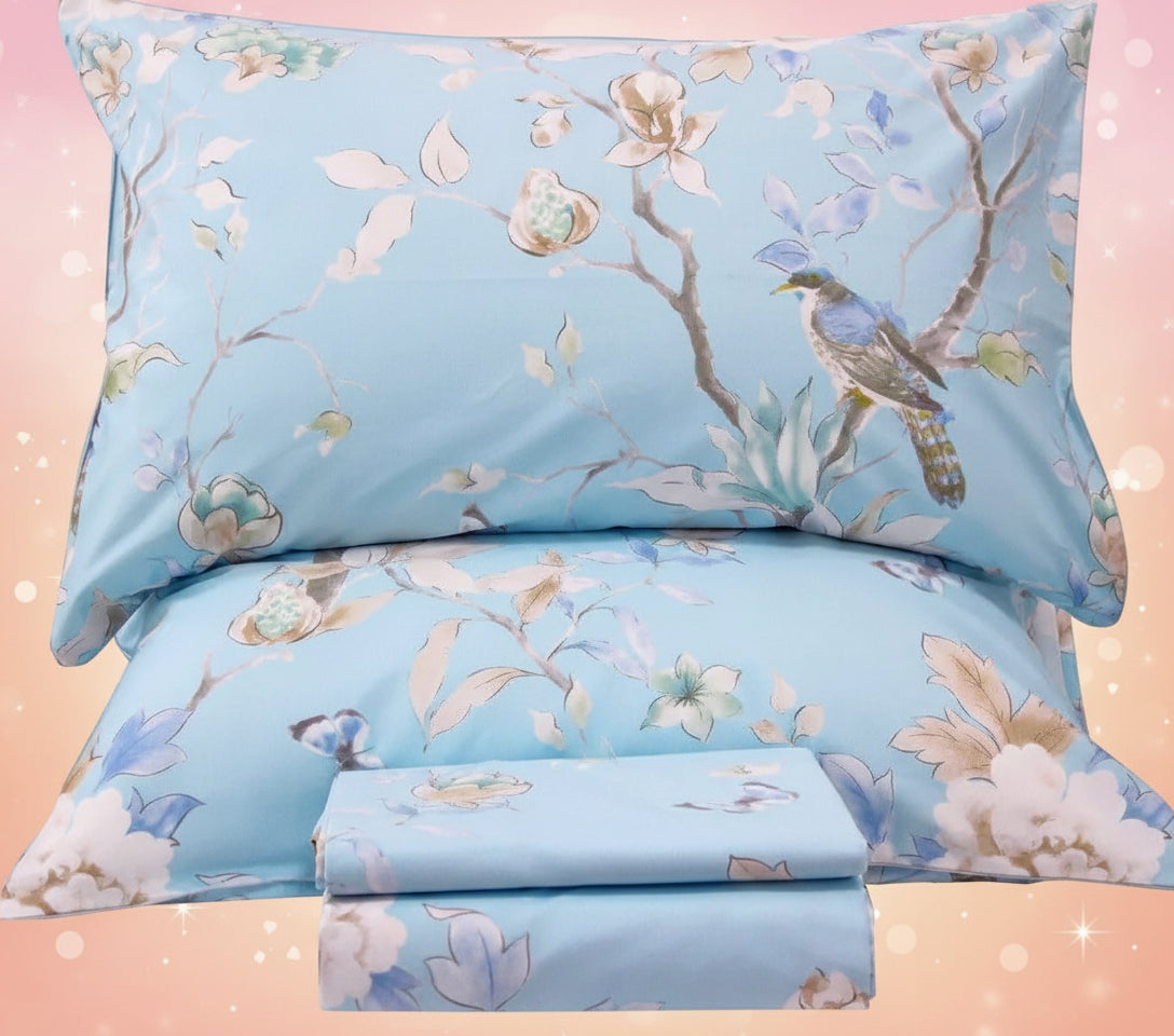 Floral and bird patterned bedding set on a white background