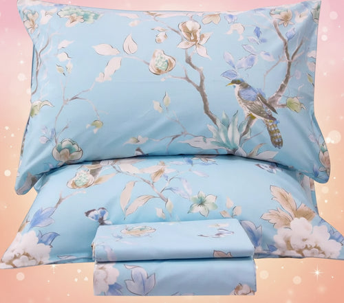 Floral and bird patterned bedding set on a white background