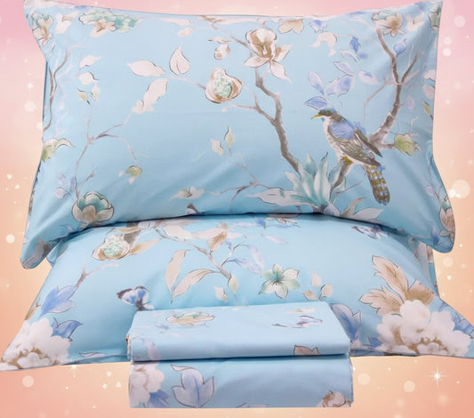 Floral and bird patterned bedding set on a white background