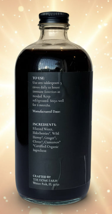 Glass bottle with black label on a light blue background