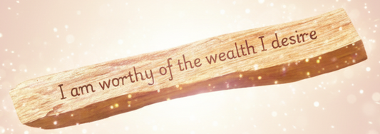 Wooden stick with engraved text on a white background