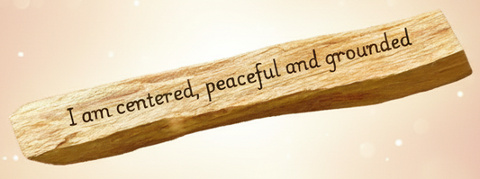 Wooden stick with engraved text on a white background