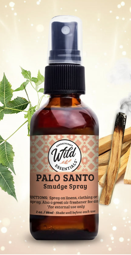 Palo Santo Smudge Spray bottle with leaves and sticks on a white background