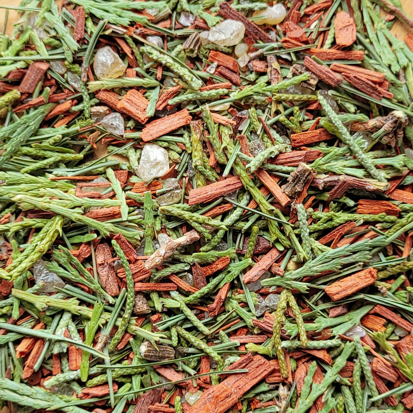 Close-up of a mix of green and red dried herbs and spices.