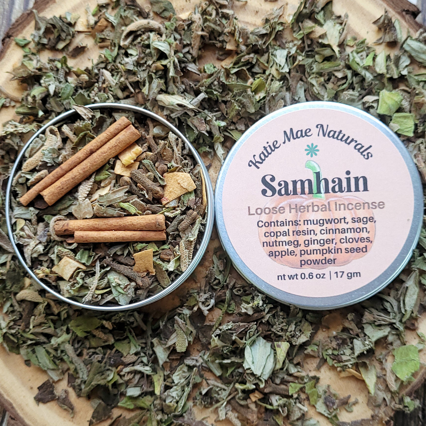Katie Mae Naturals Samhain loose herbal incense with ingredients on a wooden surface