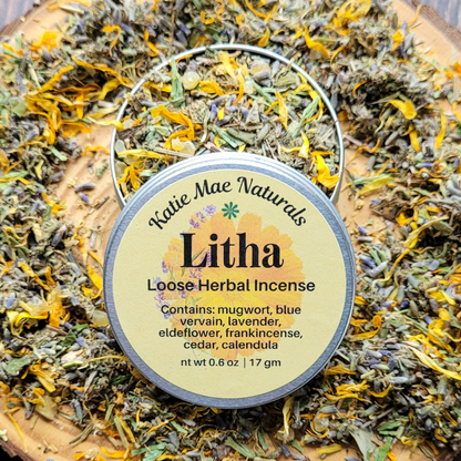 Katie Mae Naturals Litha Loose Herbal Incense container on a bed of dried herbs